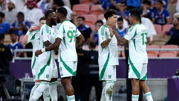 Al Ahli players celebrate after scoring a goal against Al Hilal in the Asian Champions League