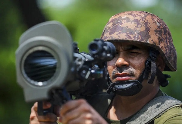 An Indian Army soldier keeps vigil near the Line of Control (LOC)