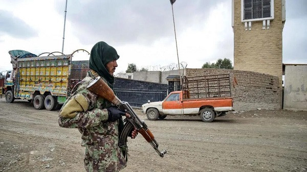 A Taliban soldier stands guard at the Afghanistan-Pakistan border