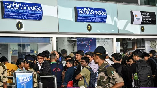 Passengers wait outside the IndiGo Airlines