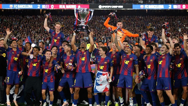 Barcelona players lift the trophy after winning the Spanish La Liga