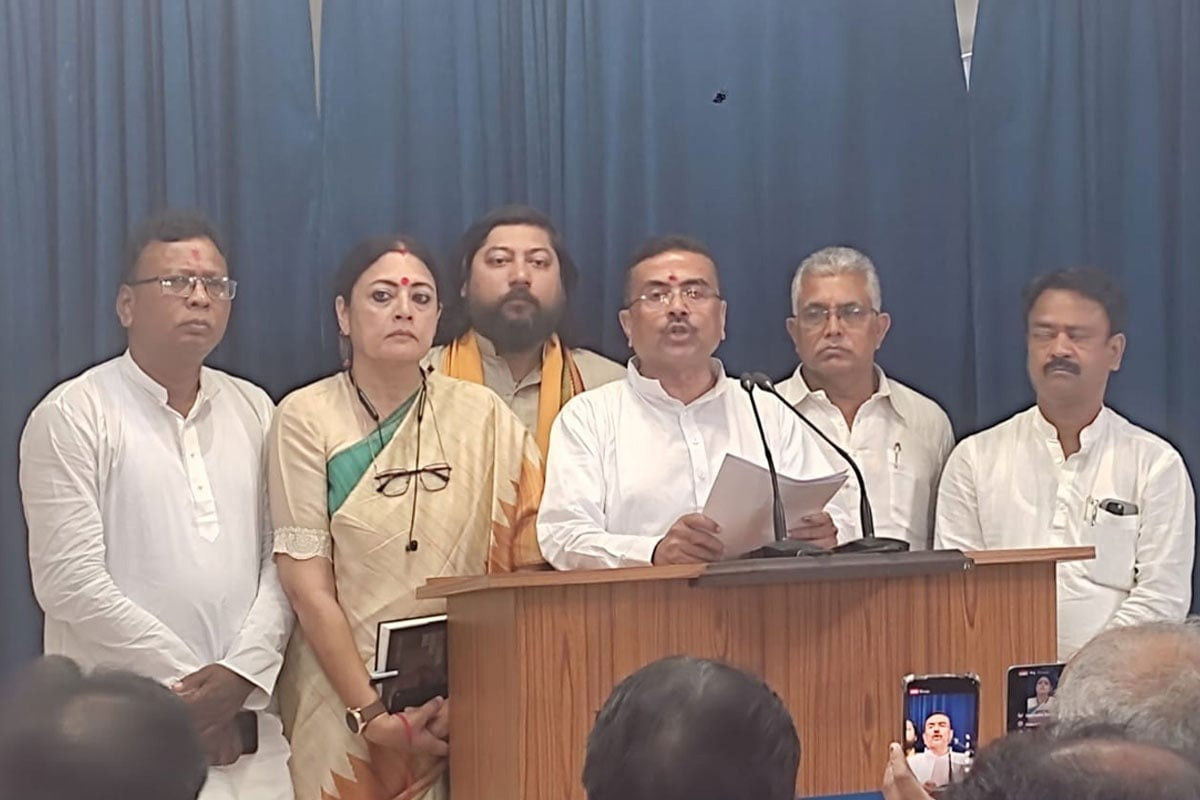Facing journalists after the first cabinet meeting.
