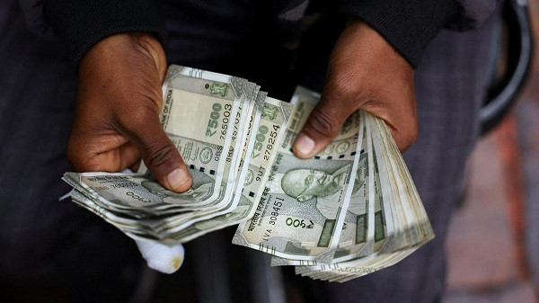 Indian Rupee fell to a fresh record low level of 96.20 against the US dollar